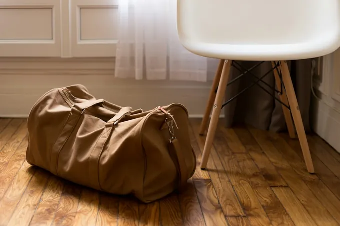 Resident keeps an orange bag inside during a move