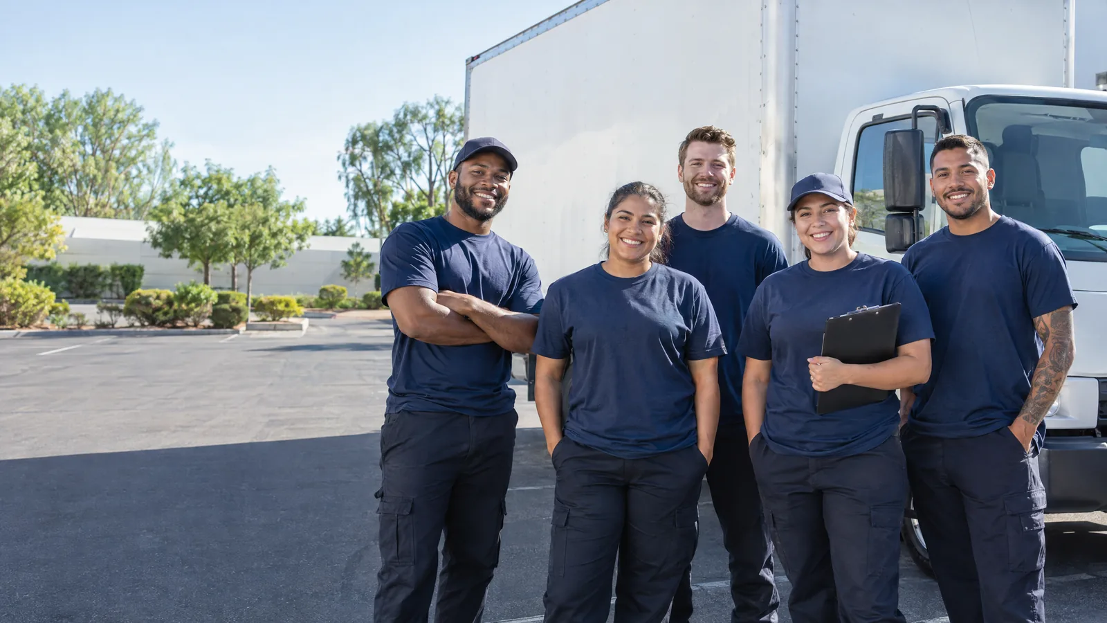 ShipShape Moving crew standing in front of a moving truck