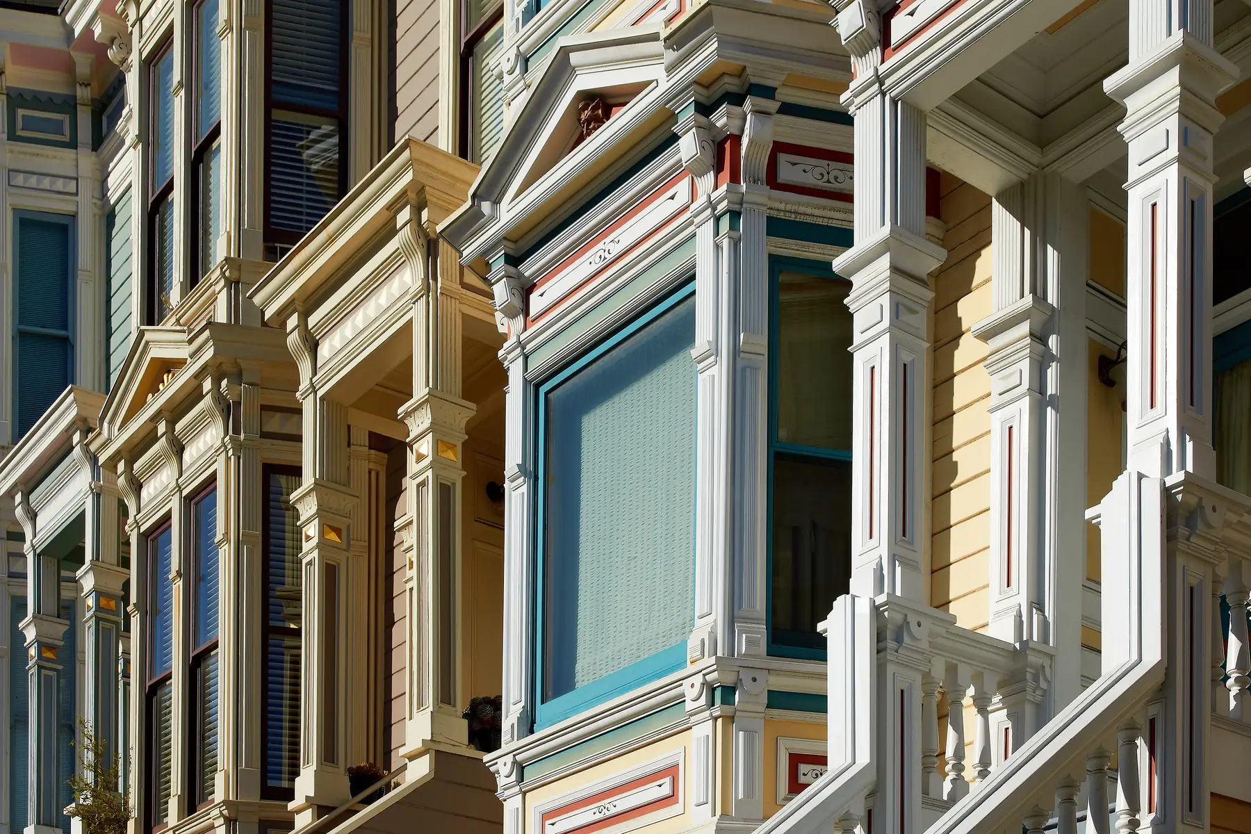 Victorian house facades on a street in San Francisco, California