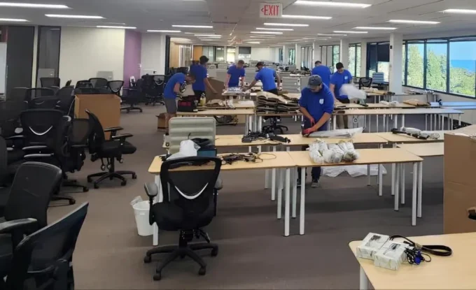 ShipShape Moving crew packing and relocating office furniture and equipment during a commercial move
