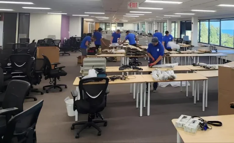 ShipShape Moving crew packing and relocating office furniture and equipment during a commercial move